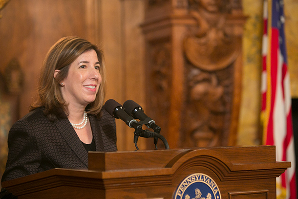 Leslie S. Richards speaking at a podium